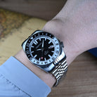 42mm black dial automatic GMT dive watch on wrist