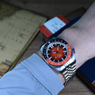 42mm orange dial automatic GMT dive watch on wrist