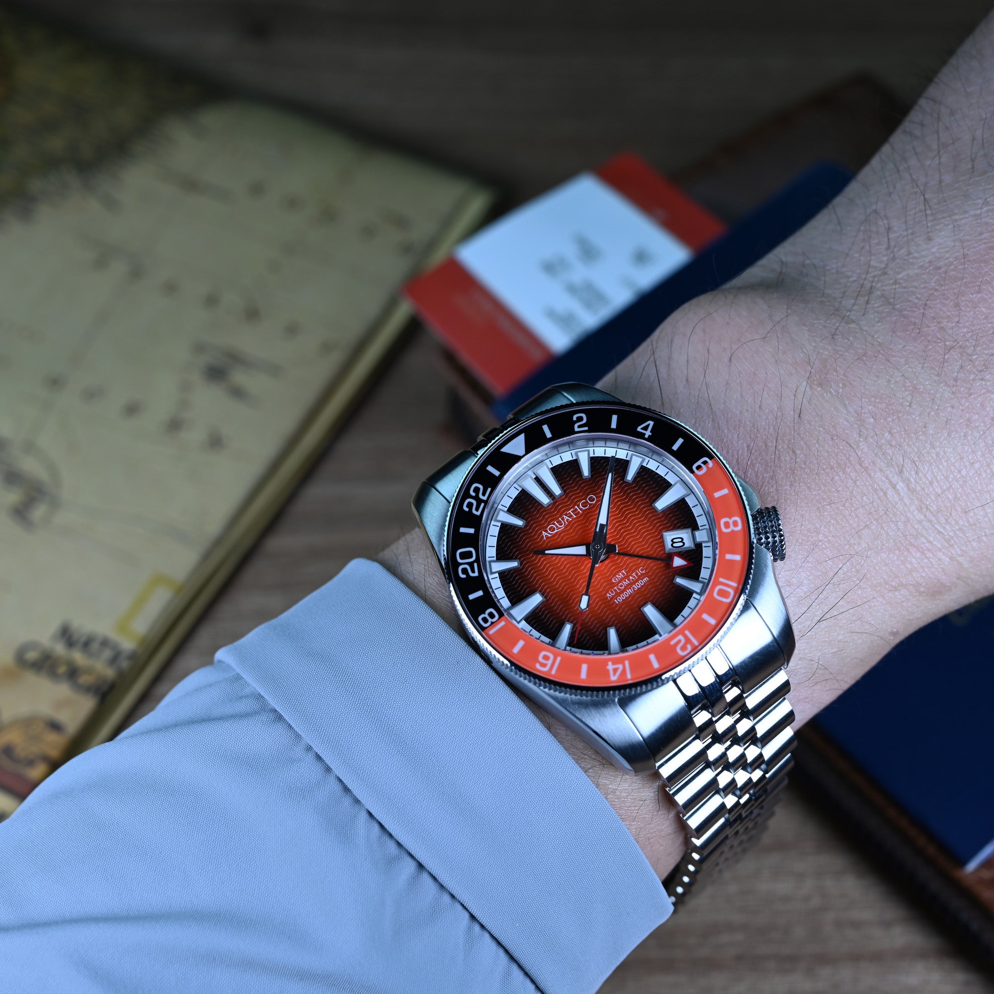 42mm orange dial automatic GMT dive watch on wrist