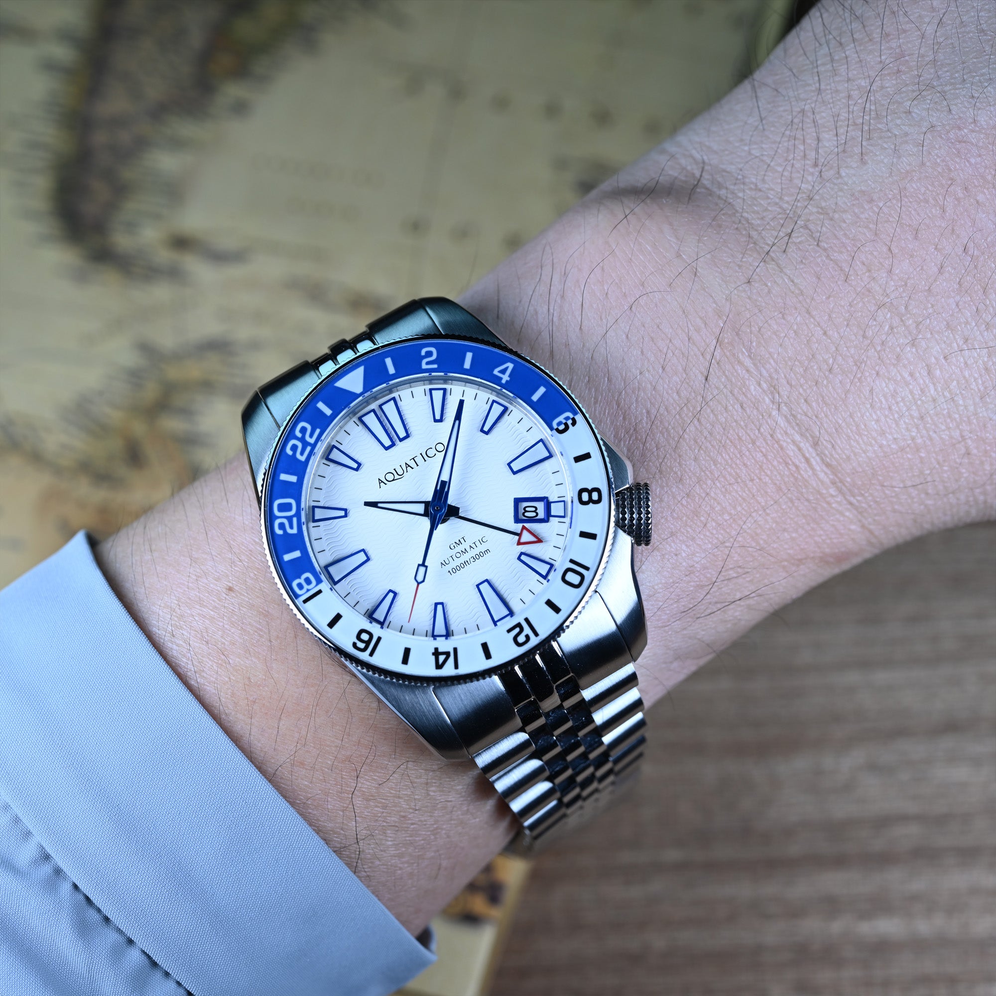 40mm white dial automatic GMT dive watch on wrist