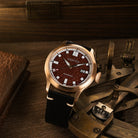 Bronze red aventurine dial watch with warm metallic tones and a distinctive handcrafted stone dial.